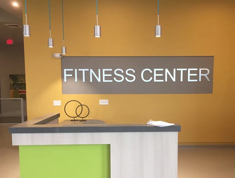 An image of interior signage for a fitness center.